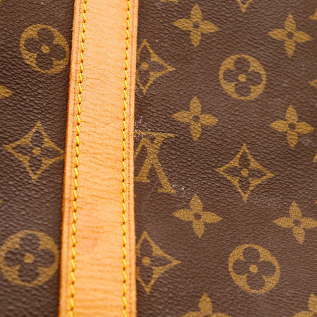 Détail sangle cuir vachette et toile Monogramme Louis Vuitton Keepall 45 — AMANA Vintage