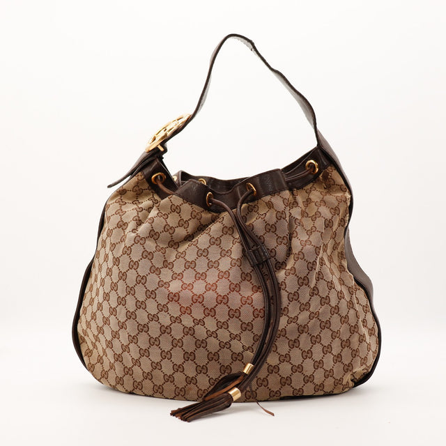 Sac Gucci Hobo GG toile monogrammée beige vue de trois quarts occasion authentique — AMANA Vintage
