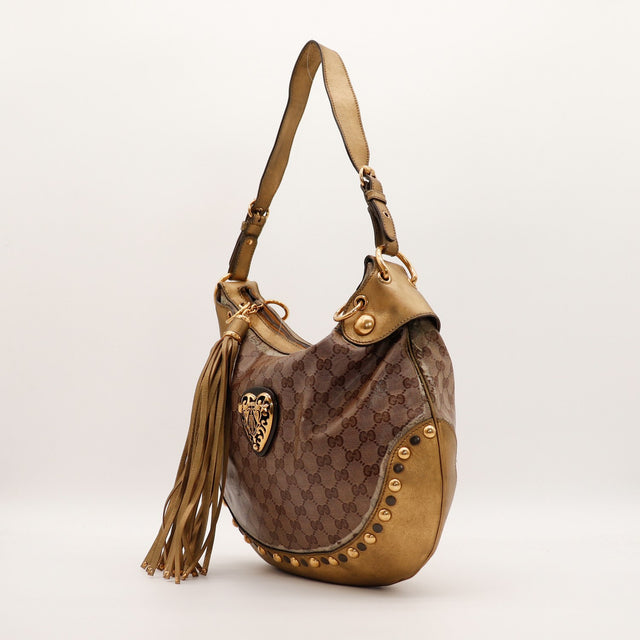 Sac Gucci Hobo Babouska cuir doré et pampille vue de trois quarts occasion authentique — AMANA Vintage