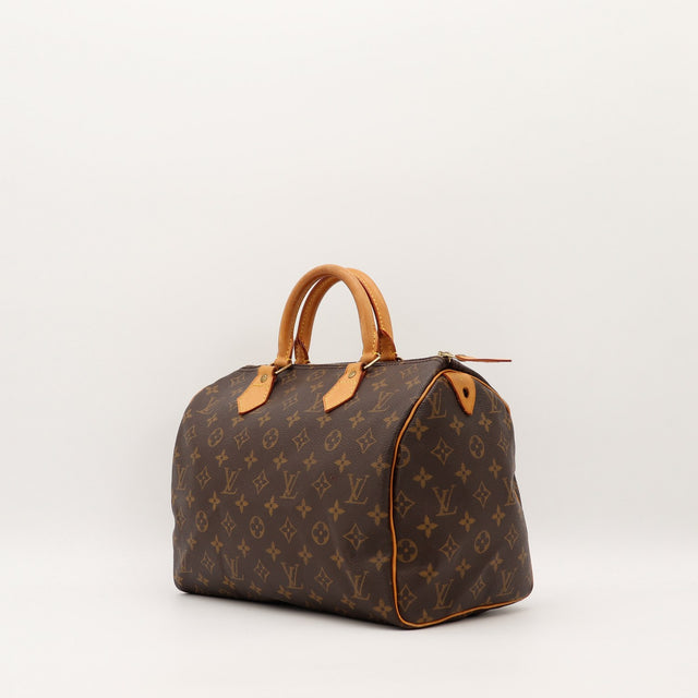 Louis Vuitton Speedy 30 vue de trois quarts toile monogramme cuir vachette caramel — AMANA Vintage