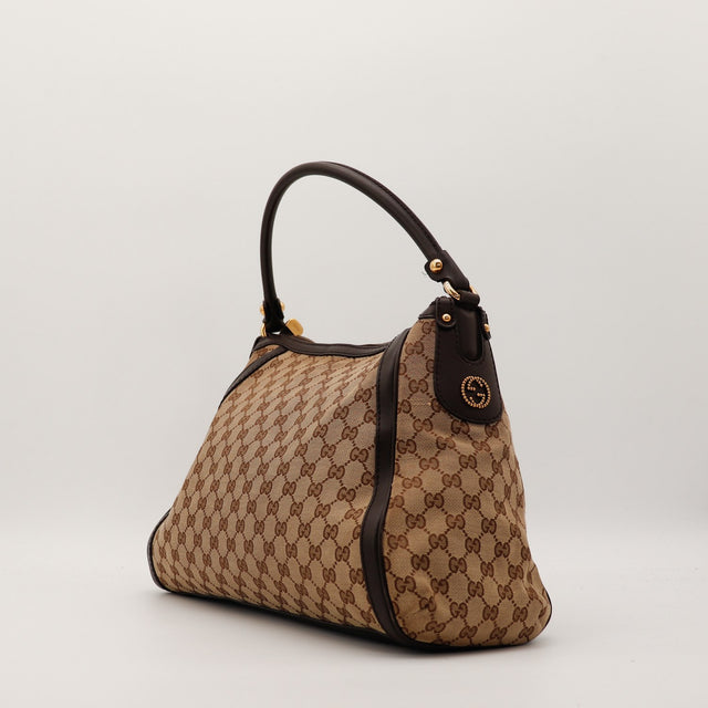 Sac Gucci Hobo toile monogrammée vue trois quarts occasion authentique — AMANA Vintage