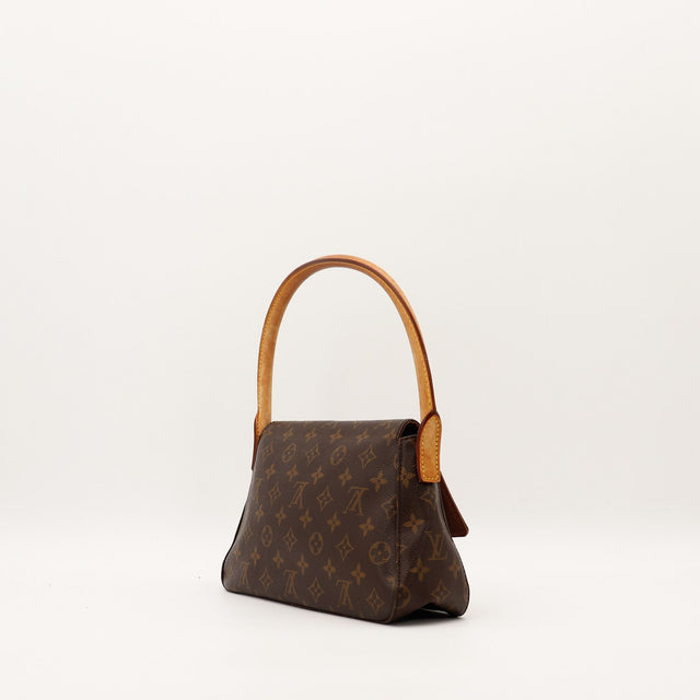 Louis Vuitton Mini Looping vue latérale gauche patine vachette occasion — AMANA Vintage