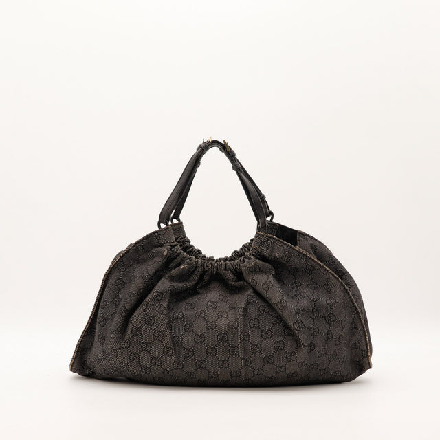 Hobo Gucci toile monogrammée noire vue de trois quarts droite — AMANA Vintage