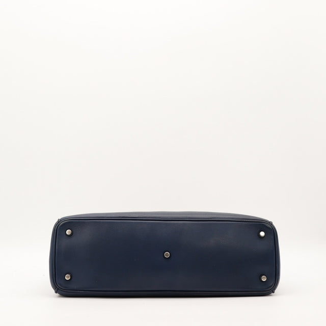 Vue du dessous Dior Diorissimo marine pieds protecteurs argentés — AMANA Vintage