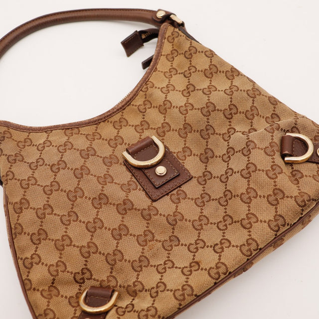 Detail anse cuir Gucci Hobo toile monogrammée occasion authentique — AMANA Vintage