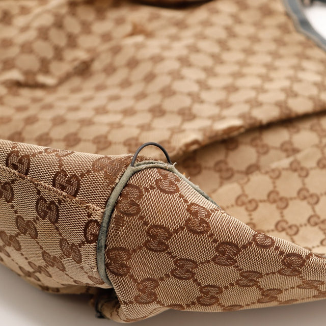 Détail toile déchirée Gucci Sukey occasion authentique — AMANA Vintage