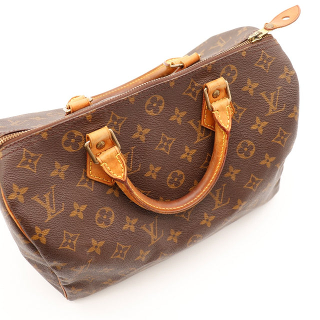 Détail anses Louis Vuitton Speedy 30 cuir vachette patine caramel — AMANA Vintage