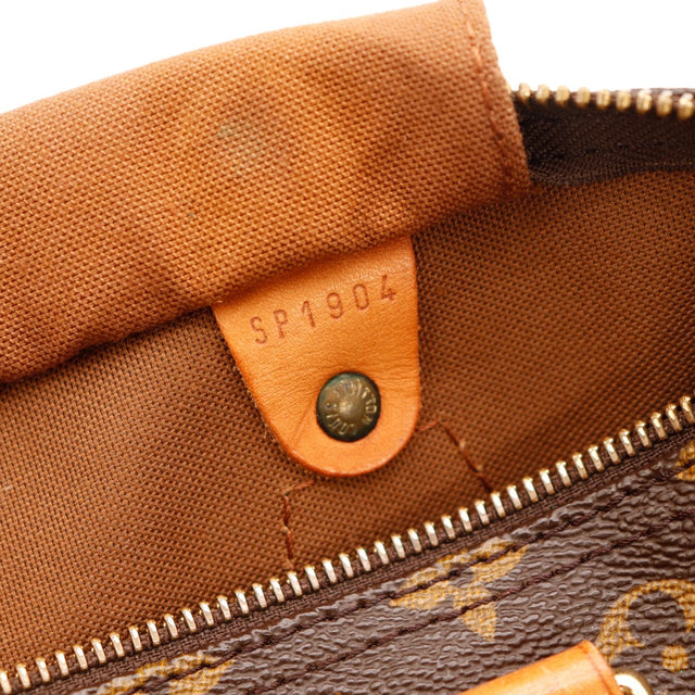 Détail anse Louis Vuitton Speedy 30 cuir vachette patine caramel légères marques — AMANA Vintage