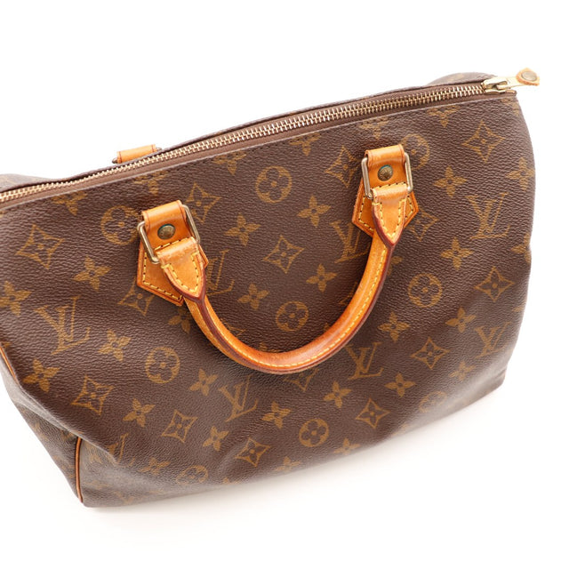 Vue anses détail Louis Vuitton Speedy 30 cuir vachette patine — AMANA Vintage