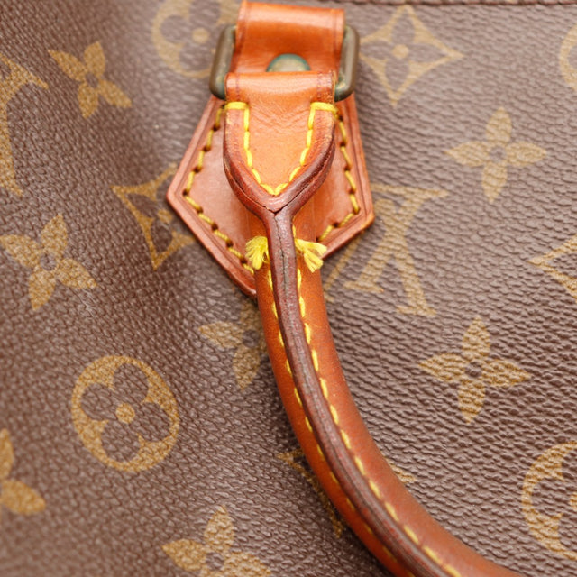 Détail tab vachette et anse Speedy 35 Louis Vuitton patine caramel — AMANA Vintage