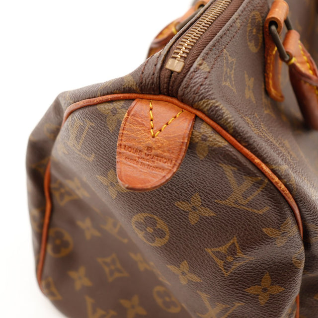 Détail coin et tab vachette Speedy 35 Louis Vuitton occasion — AMANA Vintage