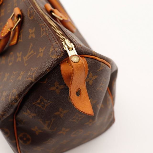Détail tirette et languette cadenas Louis Vuitton Speedy 35 cuir vachette — AMANA Vintage