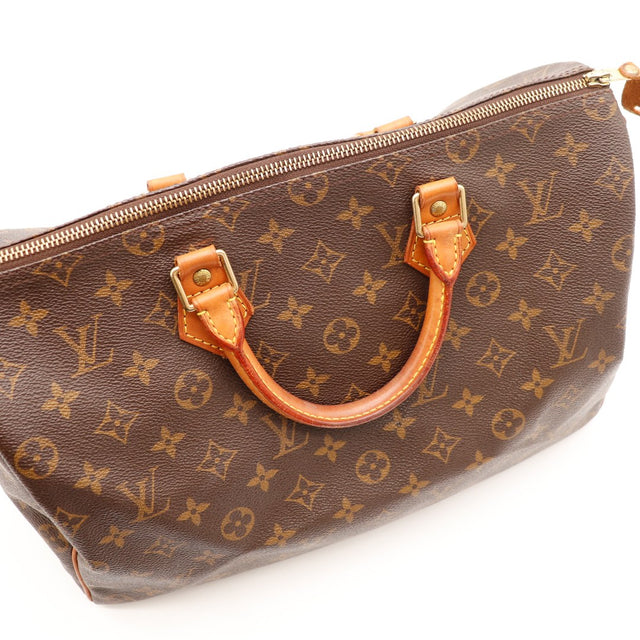 Détail anses Louis Vuitton Speedy 35 patine caramel fermeture éclair — AMANA Vintage