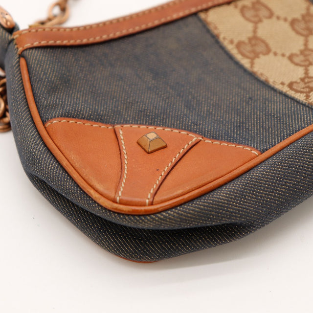 Détail coin cuir et clou Gucci pochette denim occasion authentique — AMANA Vintage