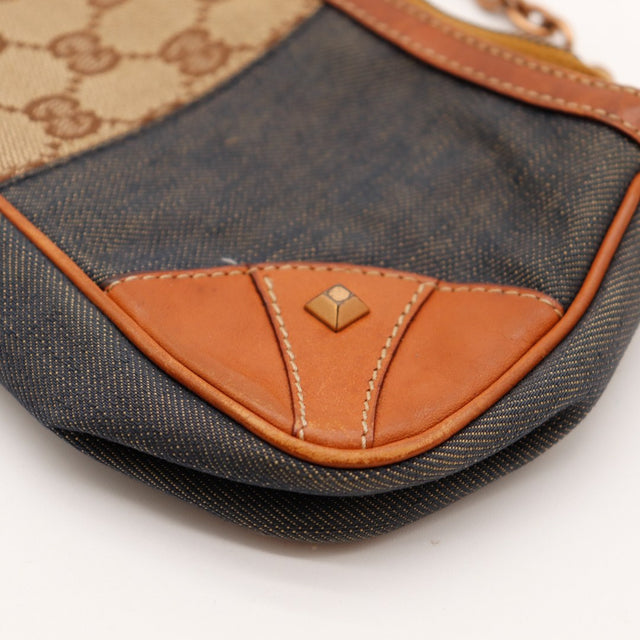 Détail coin cuir et toile denim Gucci pochette occasion authentique — AMANA Vintage
