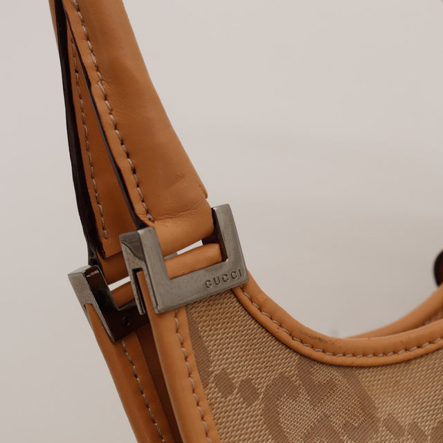 Détail attache métallique de l'anse Gucci Jackie — AMANA Vintage