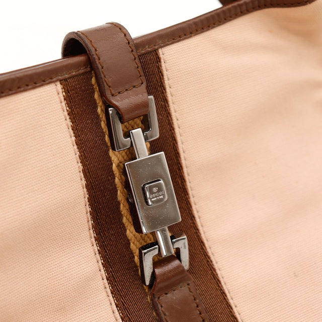 Détail fermoir piston Gucci Jackie argenté occasion authentique — AMANA Vintage