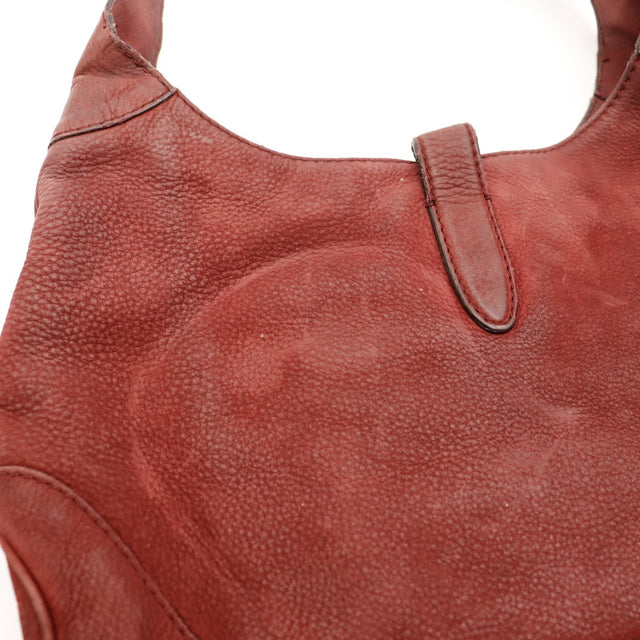 Détail patte de fermeture et cuir bordeaux Gucci New Jackie occasion authentique — AMANA Vintage
