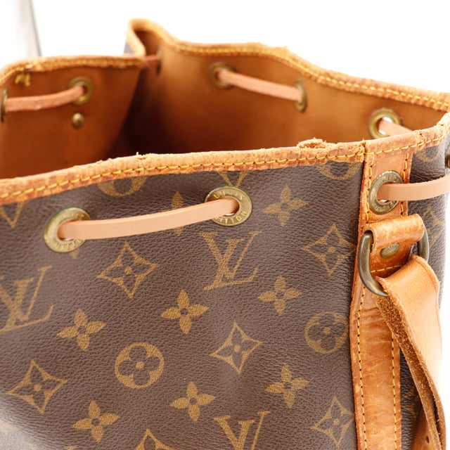 Détail bande cuir haut Louis Vuitton Petit Noé œillet doré — AMANA Vintage