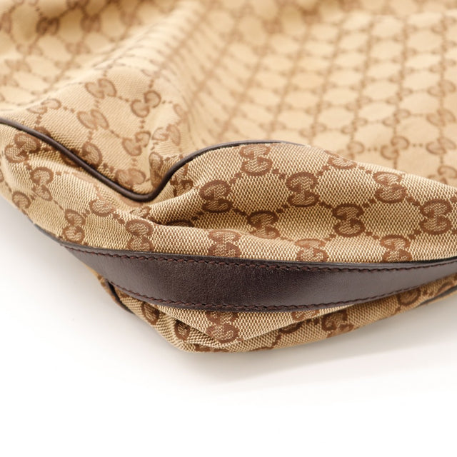 Détail coin et liseré cuir marron Gucci Hobo Interlocking G occasion authentique — AMANA Vintage