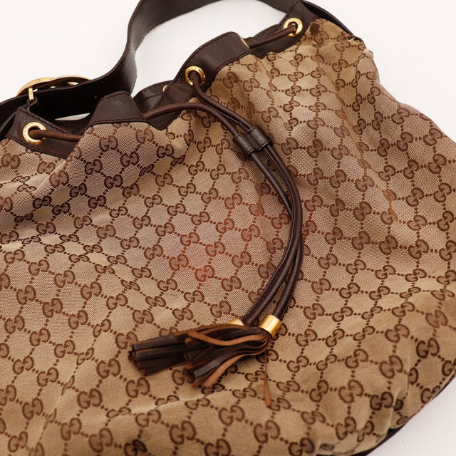 Detail cordon de serrage et pampilles Gucci Hobo GG occasion authentique — AMANA Vintage