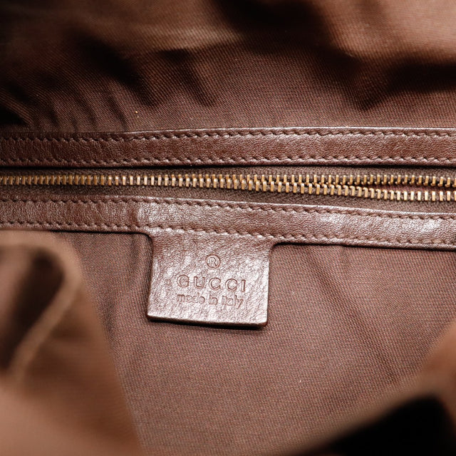 Detail plaque Gucci made in Italy interieur Gucci Hobo GG — AMANA Vintage