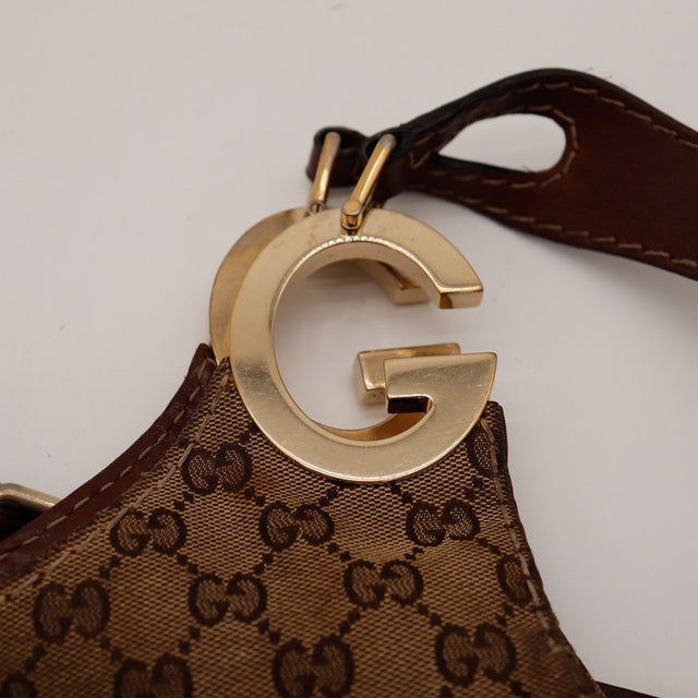 Détail charm G doré Gucci Hobo rayures — AMANA Vintage