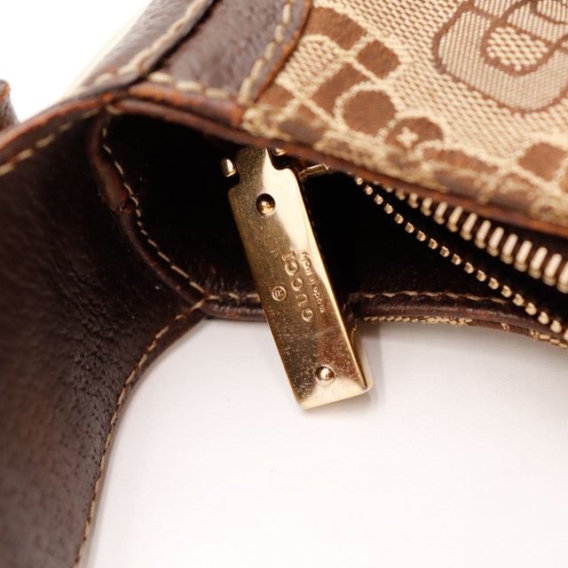 Détail plaque Gucci et tirette zip Hobo Horsebit occasion authentique — AMANA Vintage