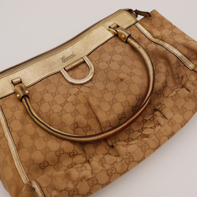Détail anneau D-Ring et bande cuir dorée Gucci — AMANA Vintage