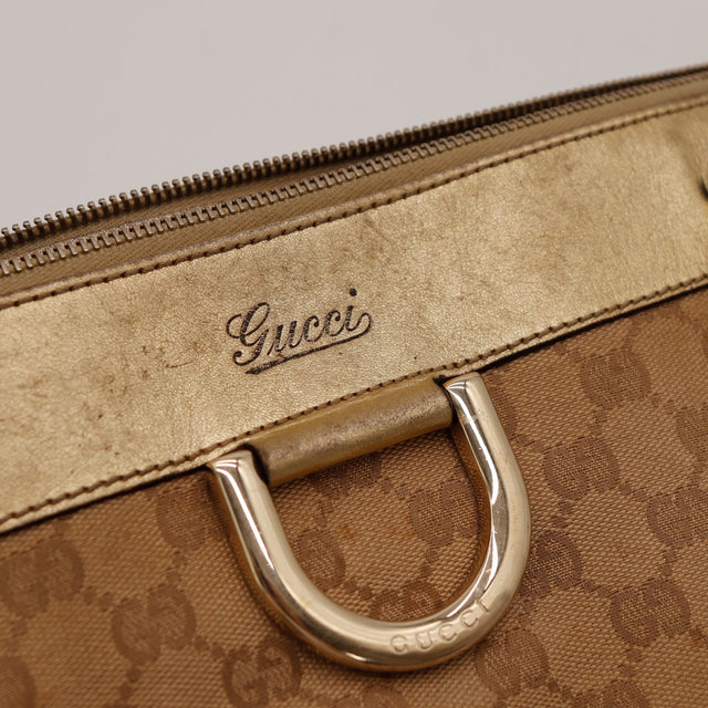 Détail signature Gucci cursive et anneau signature — AMANA Vintage