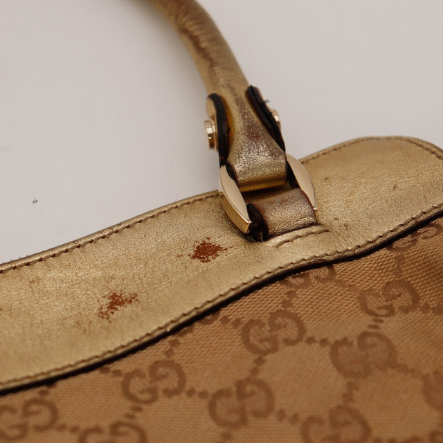 Détail attache anse gauche cuir métallisé plaquage parti Gucci — AMANA Vintage