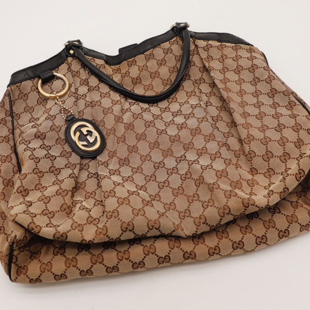 Détail de l'intérieur Gucci Tote toile monogrammée beige et ébène occasion authentique — AMANA Vintage