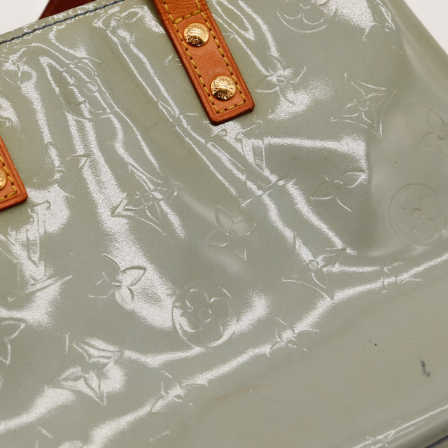 Détail anses vachette et rivets dorés Louis Vuitton Reade PM Vernis — AMANA Vintage
