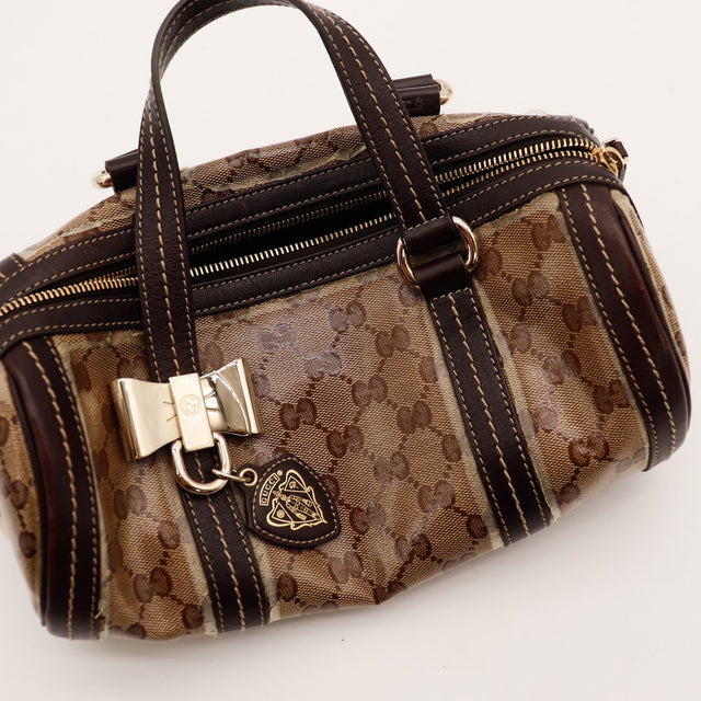 Détail anses cuir marron sac Gucci Boston occasion authentique — AMANA Vintage