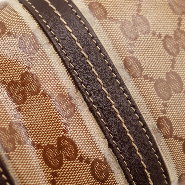 Détail toile monogrammée enduite et bordure cuir Gucci Boston occasion authentique — AMANA Vintage