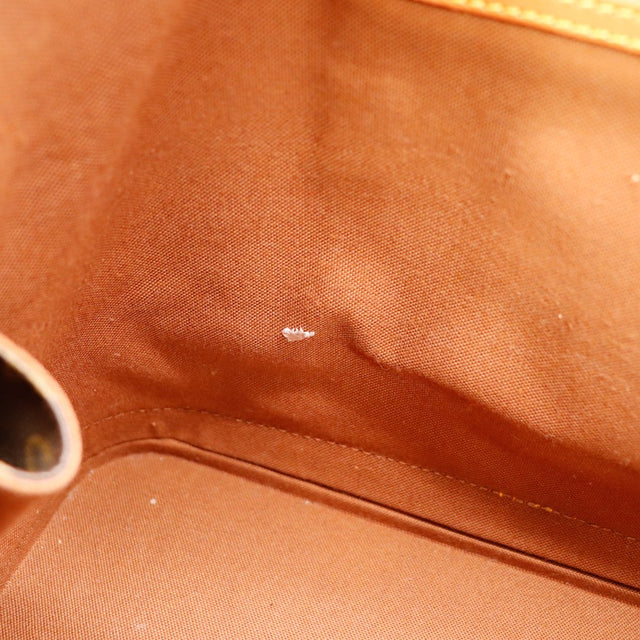 Détail marque sur la doublure intérieure Louis Vuitton Alma PM — AMANA Vintage