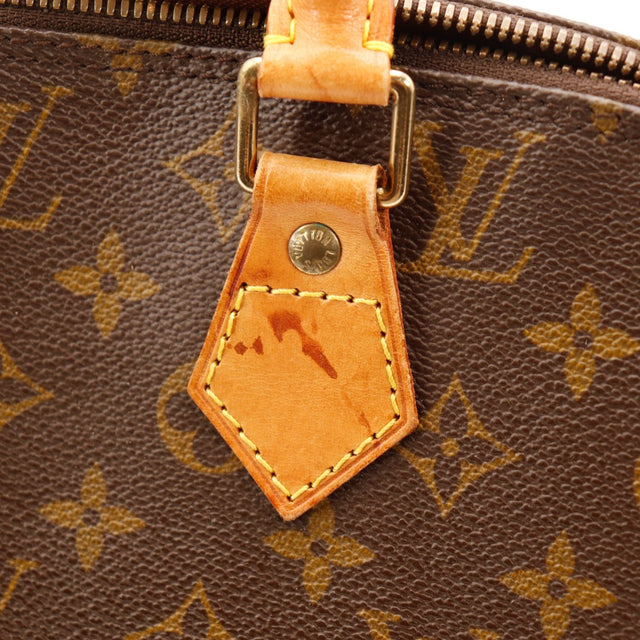 Détail attache cuir des anses Louis Vuitton Alma PM — AMANA Vintage