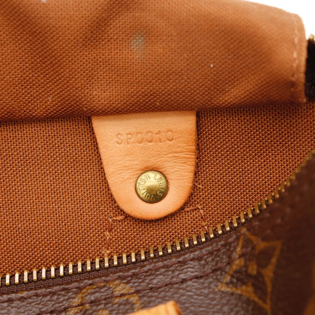 Détail des anses Louis Vuitton Speedy 25 Toile Monogramme occasion authentique — AMANA Vintage