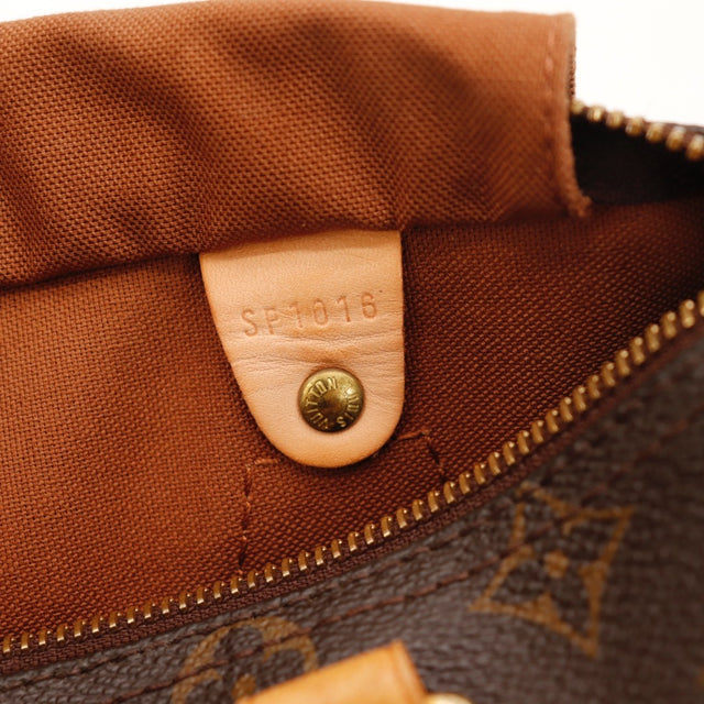 Détail du cuir vachette patiné Louis Vuitton Speedy 25 occasion authentique — AMANA Vintage