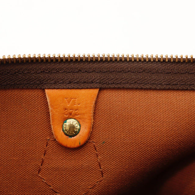 Détail de la base des anses Louis Vuitton Speedy 35 cuir vachette occasion authentique — AMANA Vintage