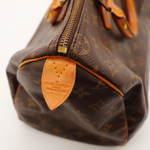 Détail de la fermeture Louis Vuitton Speedy 35 Toile Monogramme occasion authentique — AMANA Vintage