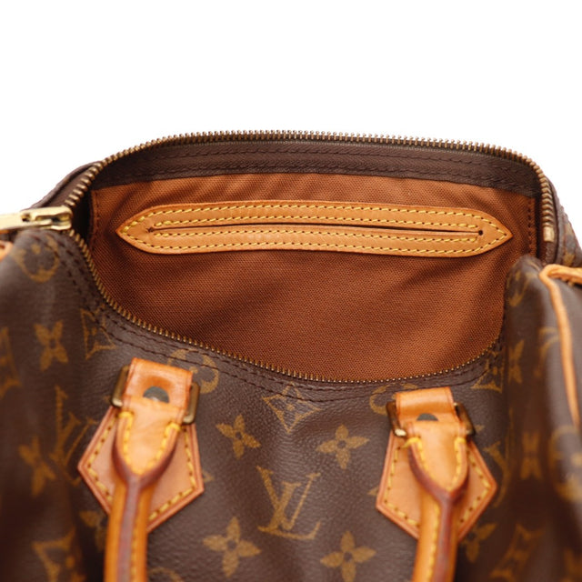 Gros plan de la fermeture Louis Vuitton Speedy 25 Toile Monogramme occasion authentique — AMANA Vintage