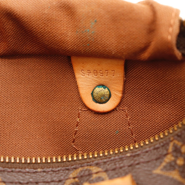 Détail de la patine Louis Vuitton Speedy 25 cuir vachette occasion authentique — AMANA Vintage