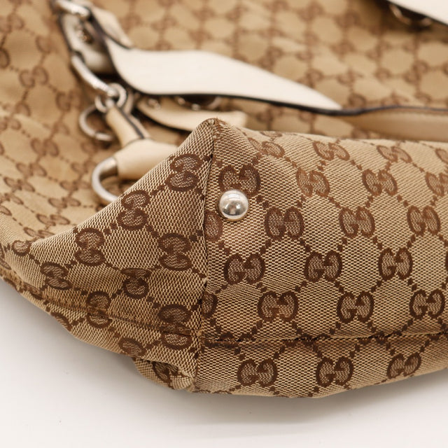Détail coin inférieur Tote Gucci monogramme et cuir ivoire — AMANA Vintage