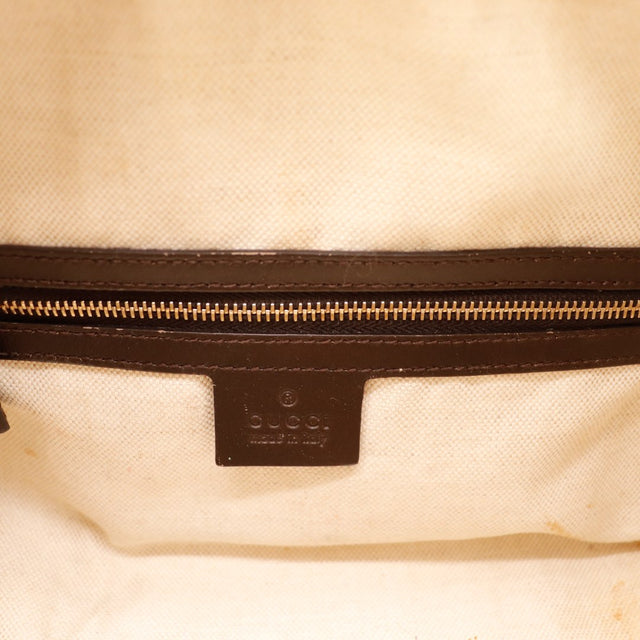 Détail coin supérieur sac Gucci Boston Joy Web boucle anse cuir marron — AMANA Vintage