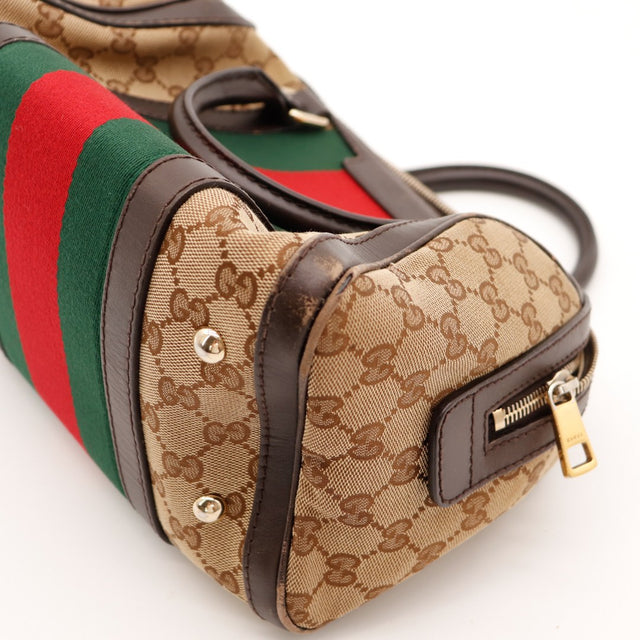 Détail coin inférieur sac Gucci Boston Joy Web usure cuir occasion — AMANA Vintage