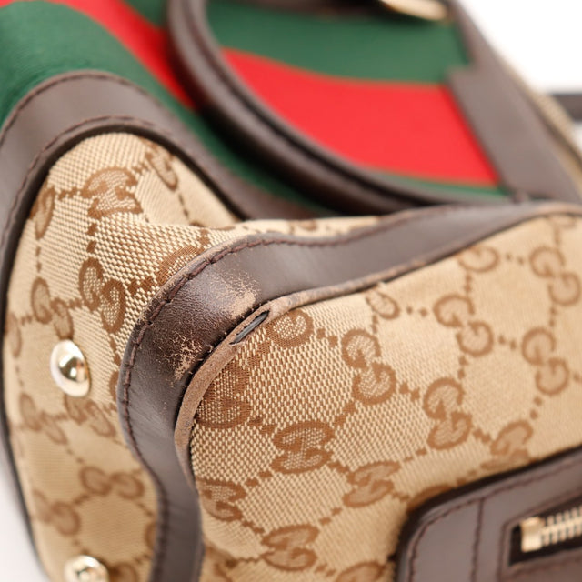 Détail tirette zip doré Gucci Boston Joy Web curseur occasion — AMANA Vintage