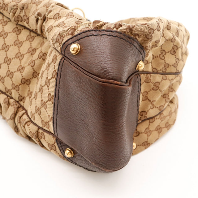 Détail coin supérieur Hobo Gucci cuir marron et toile monogrammée — AMANA Vintage