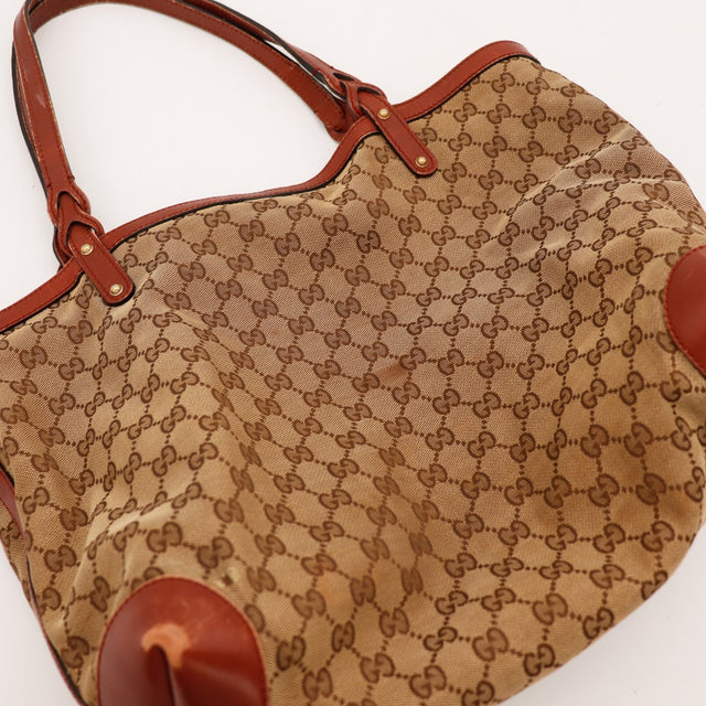 Détail anses et attaches Tote Bag Gucci cuir rouge occasion — AMANA Vintage