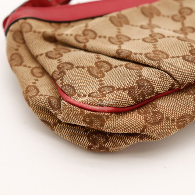 Détail coin inférieur canvas monogramme Gucci pochette rouge — AMANA Vintage